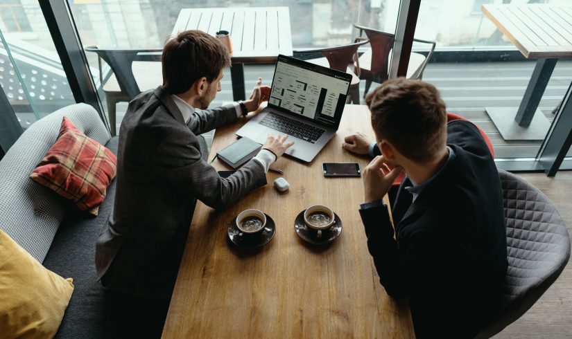 two-young-businessman-having-a-successful-meeting-at-restaurant